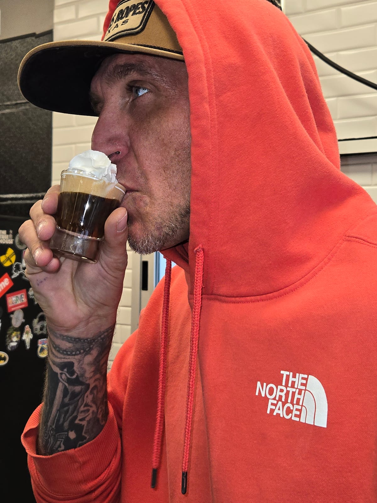 Taking the first sip of a Cafe Con Panna, espresso under real whipped cream, in the City Boy shop